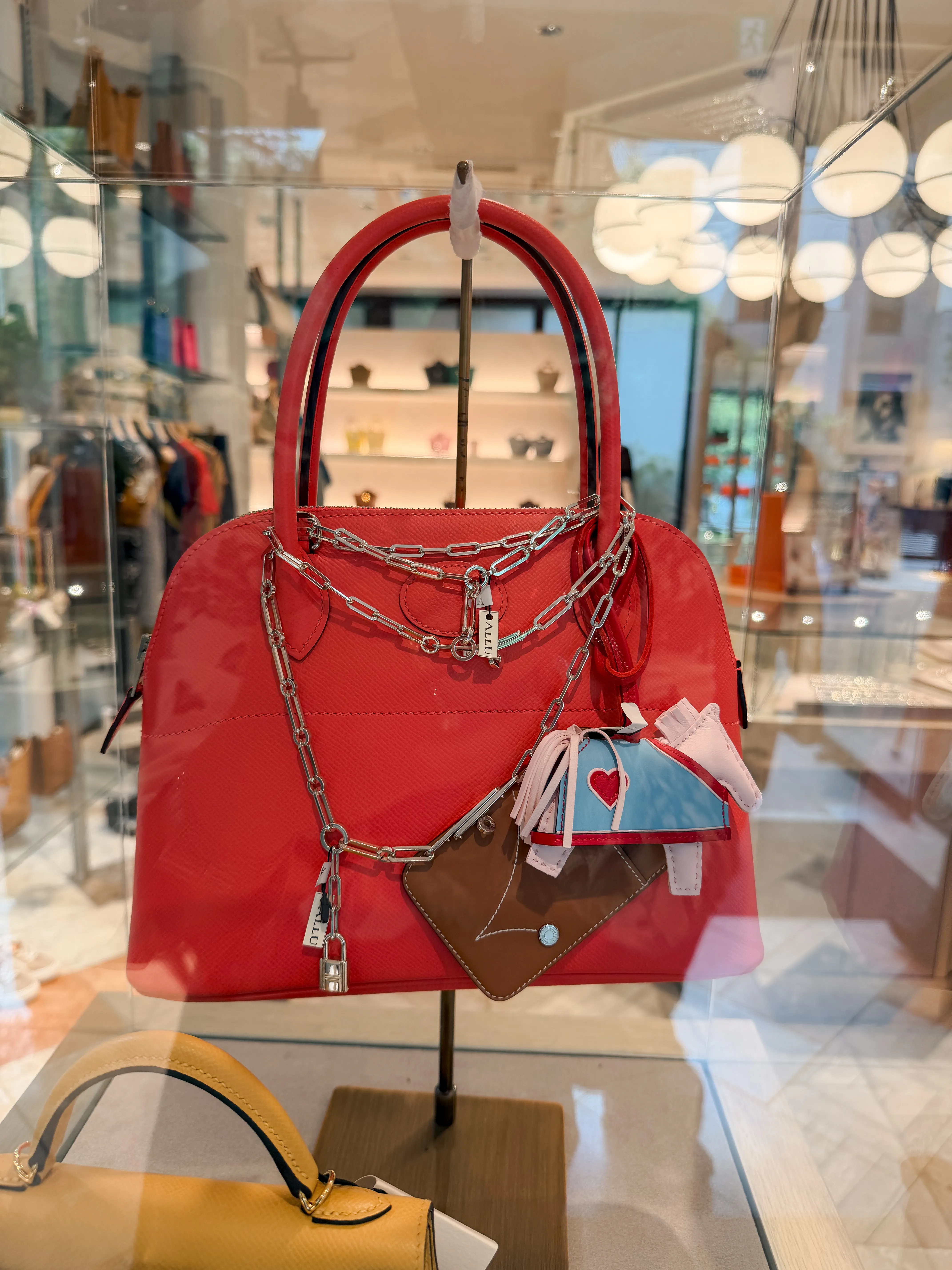 Red Hermès Bolide with charms at ALLU Tokyo