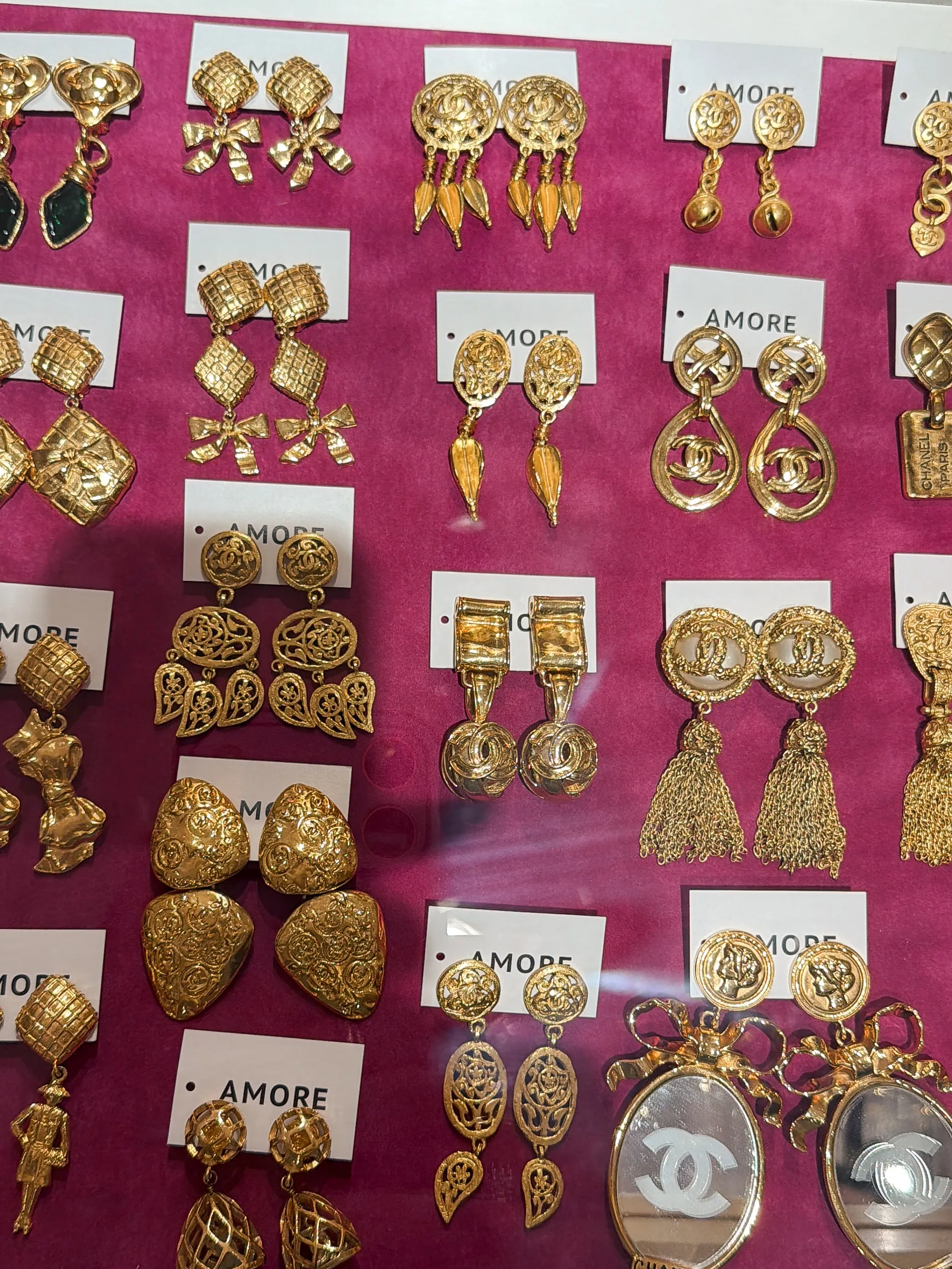 Gold Chanel statement earrings at Amore Vintage