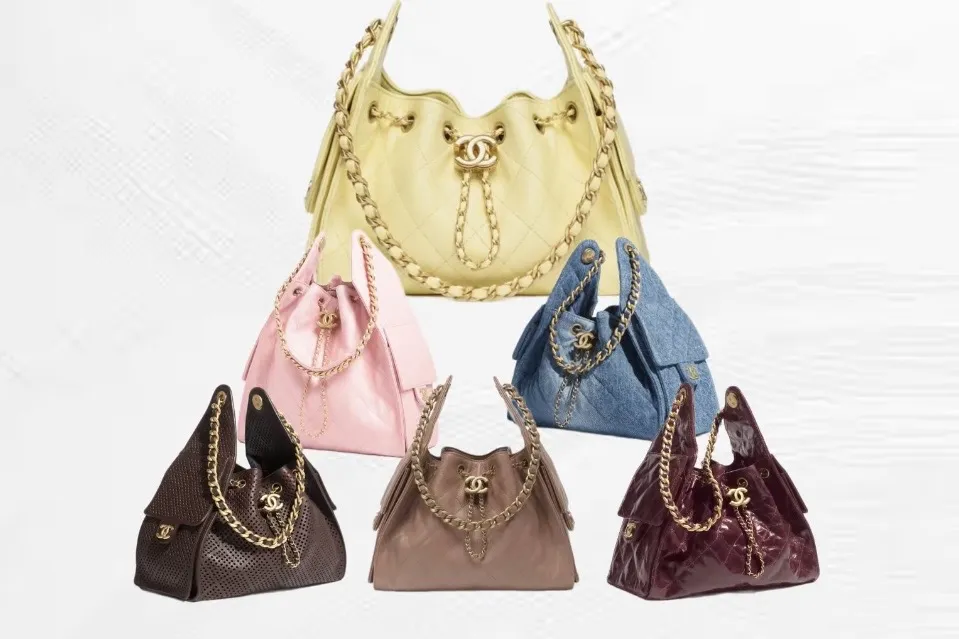 Six Chanel 25 handbags together in yellow, pink, blue denim, burgundy, taupe and brown perforated leather