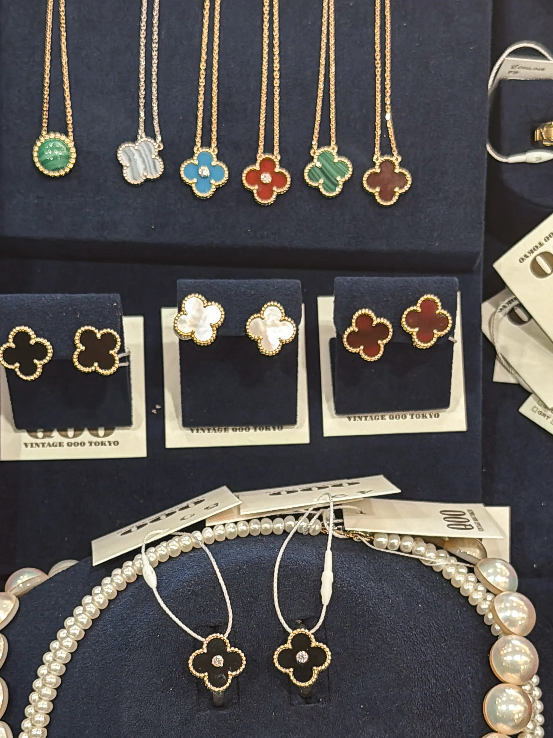 Necklaces and earrings displayed at Vintage QOO Tokyo